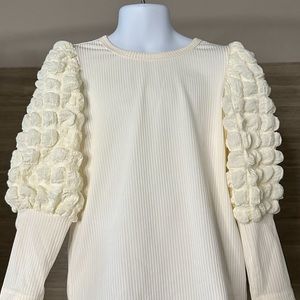 White/beige girls sweater with fantasy on sleeves